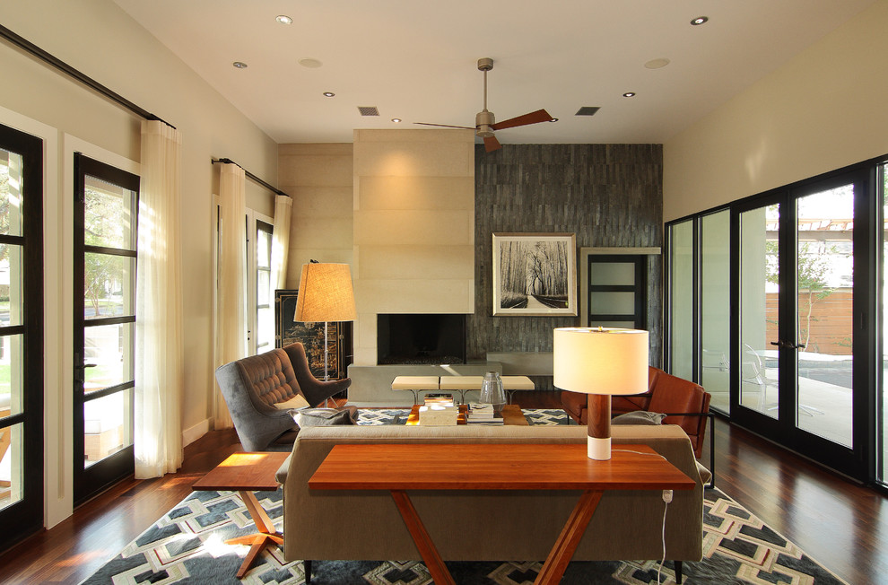 This is an example of a contemporary living room in Austin with beige walls.
