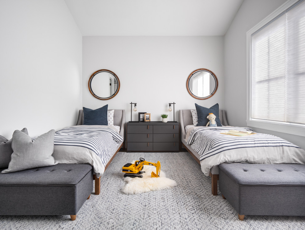 This is an example of a mid-sized transitional kids' room for boys in Orange County with white walls, light hardwood floors, brown floor and vaulted.