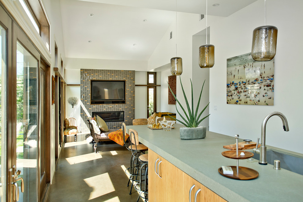 Inspiration for a beach style kitchen in Los Angeles with flat-panel cabinets, light wood cabinets and quartz benchtops.