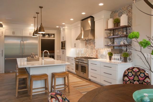 Kitchen - kitchen idea with a farmhouse sink, flat-panel cabinets, white cabinets, quartz countertops, multicolored backsplash, ceramic backsplash, stainless steel appliances and an island