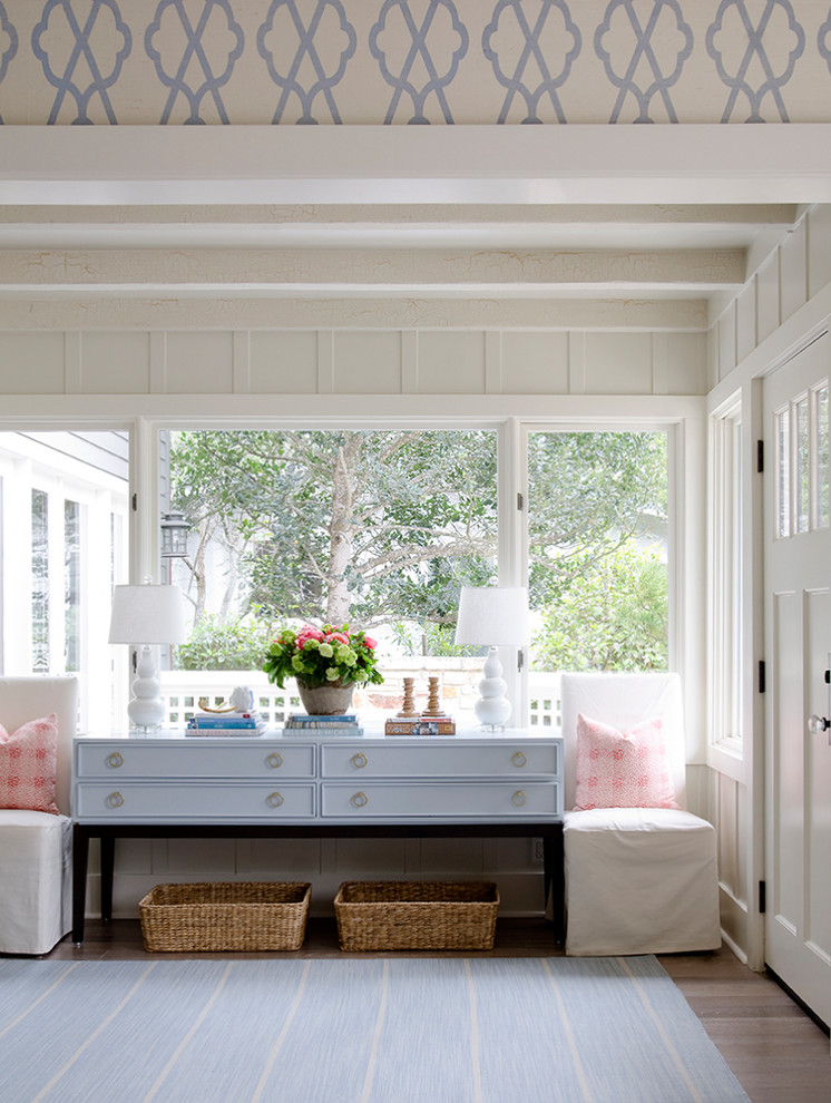 Example of a mid-sized beach style single front door design in San Francisco with white walls