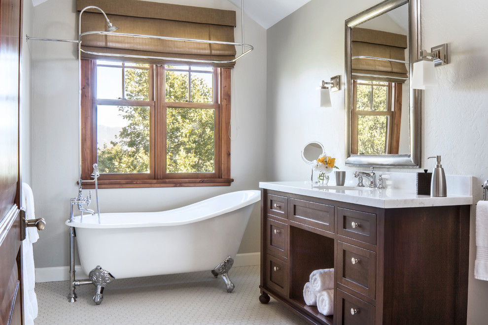 Design ideas for a mid-sized arts and crafts master bathroom in Santa Barbara with dark wood cabinets, a claw-foot tub, grey walls, an undermount sink, a shower/bathtub combo, a shower curtain, recessed-panel cabinets, a two-piece toilet, white tile, mosaic tile, mosaic tile floors and marble benchtops.