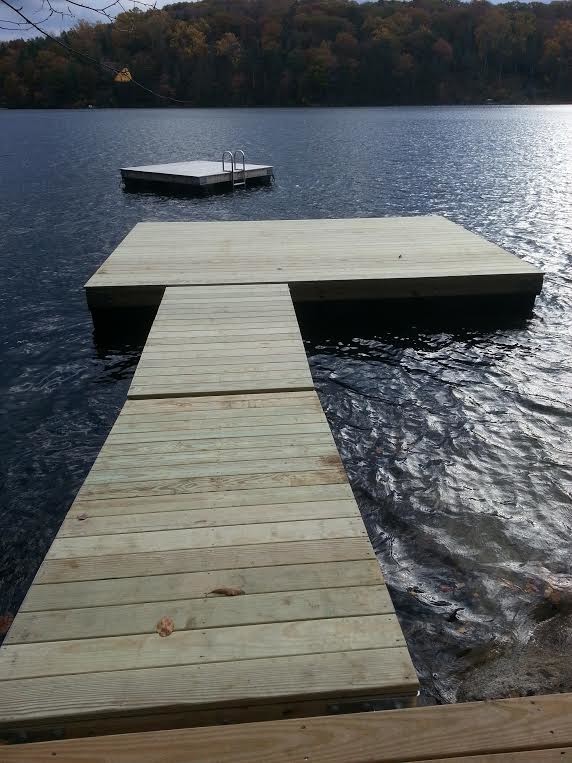 Mountain style backyard dock photo in New York