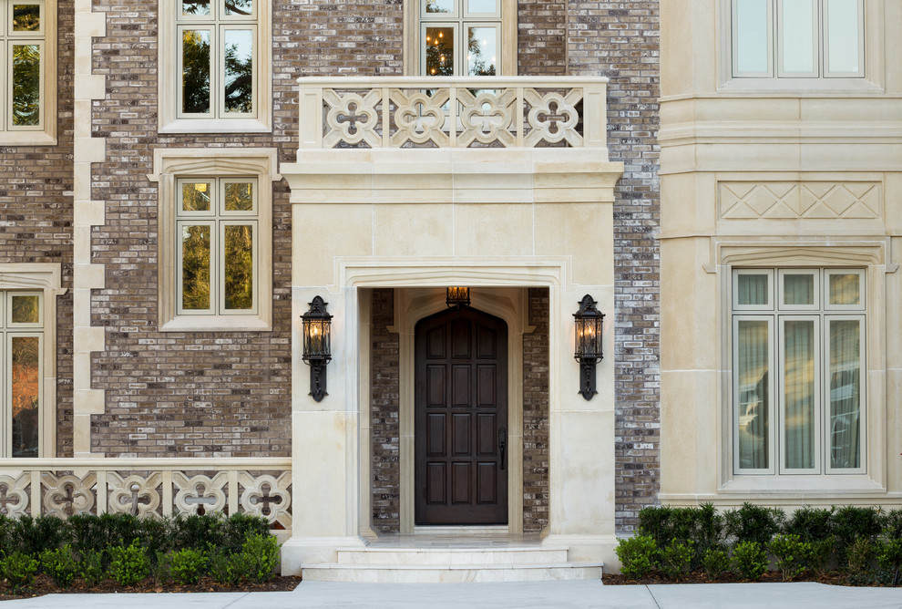 Photo of a traditional front door in Tampa with a single front door and a dark wood front door.