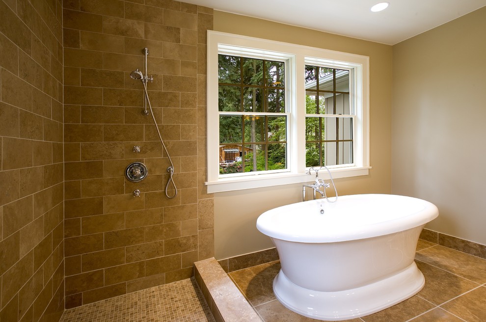 Photo of a mid-sized traditional master bathroom in Seattle with a freestanding tub, shaker cabinets, white cabinets, a corner shower, brown tile, ceramic tile, beige walls, ceramic floors, an undermount sink, granite benchtops and brown floor.
