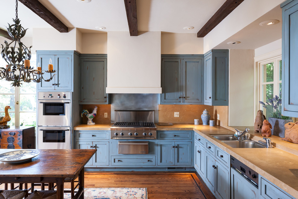 Design ideas for a country kitchen in San Francisco with blue cabinets.