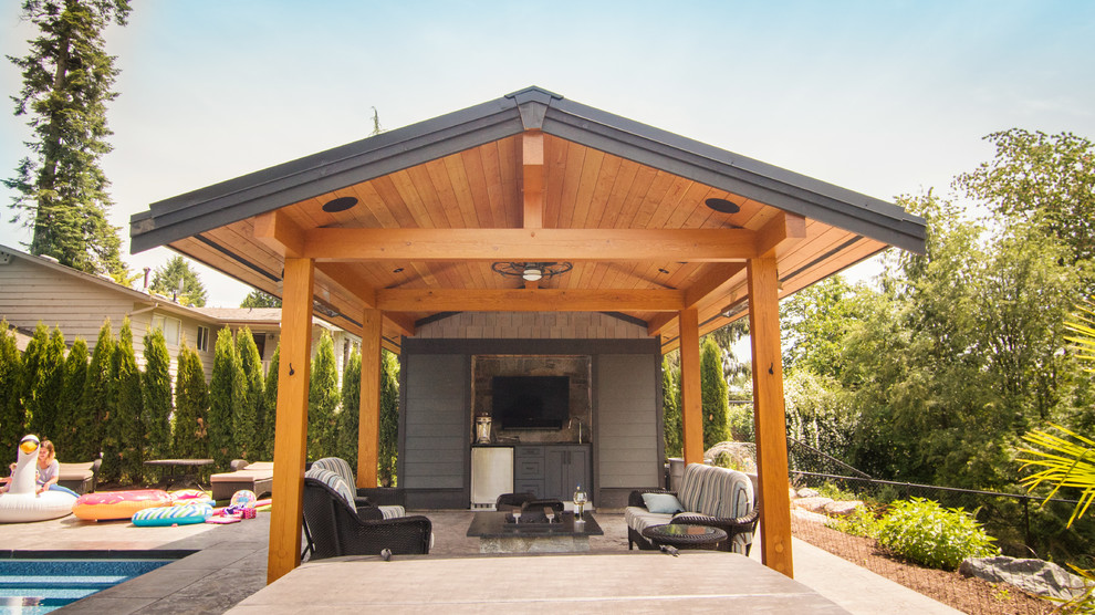 Inspiration for a mid-sized midcentury backyard patio in Vancouver with tile and a gazebo/cabana.