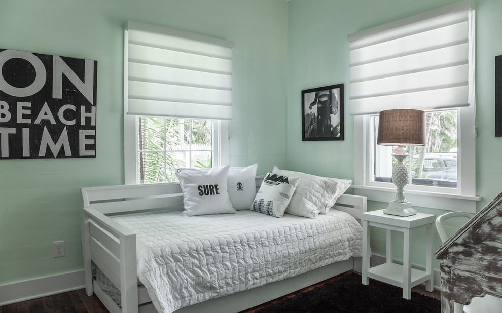 Inspiration for a transitional master bedroom in Miami with blue walls and light hardwood floors.