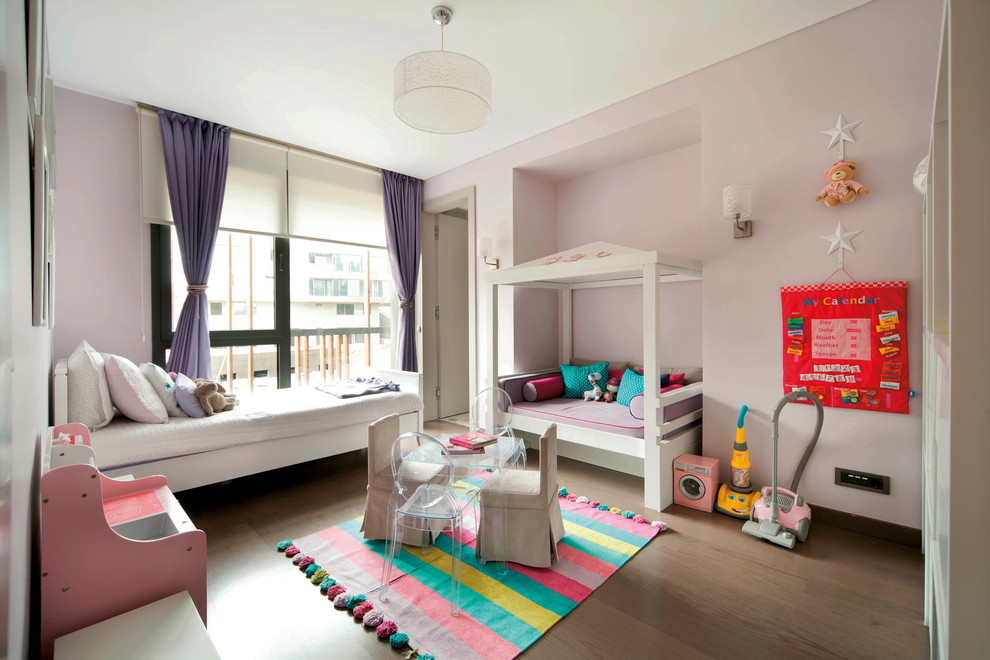Design ideas for a contemporary kids' bedroom for kids 4-10 years old and girls in Other with pink walls.