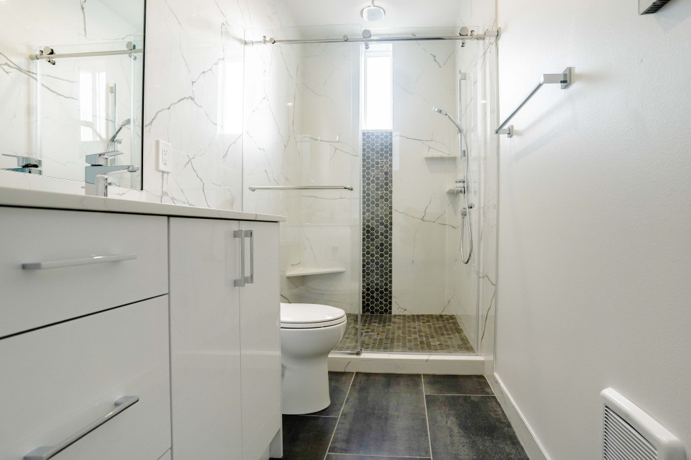 Inspiration for a medium sized contemporary grey and white shower room bathroom in Seattle with a freestanding vanity unit, white cabinets, white tiles, marble tiles, quartz worktops, white worktops, double sinks, a one-piece toilet, white walls, vinyl flooring, brown floors and a sliding door.