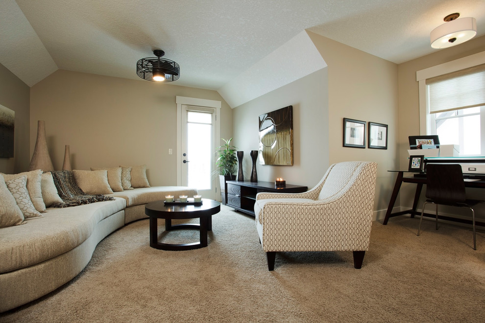 Design ideas for a traditional family room in Calgary with beige walls and carpet.