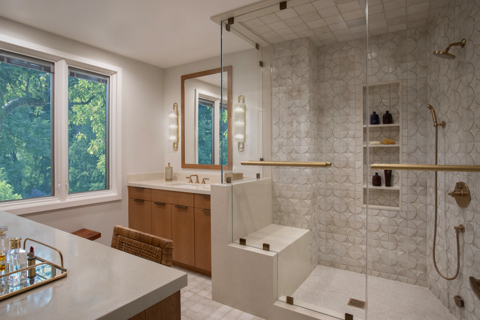 This is an example of a contemporary bathroom in Los Angeles with flat-panel cabinets, medium wood cabinets, a corner shower, beige tile, white walls, an undermount sink, beige floor, a hinged shower door, beige benchtops, a single vanity and a built-in vanity.