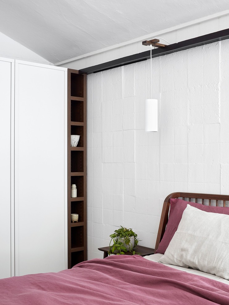 This is an example of a midcentury bedroom in Melbourne.