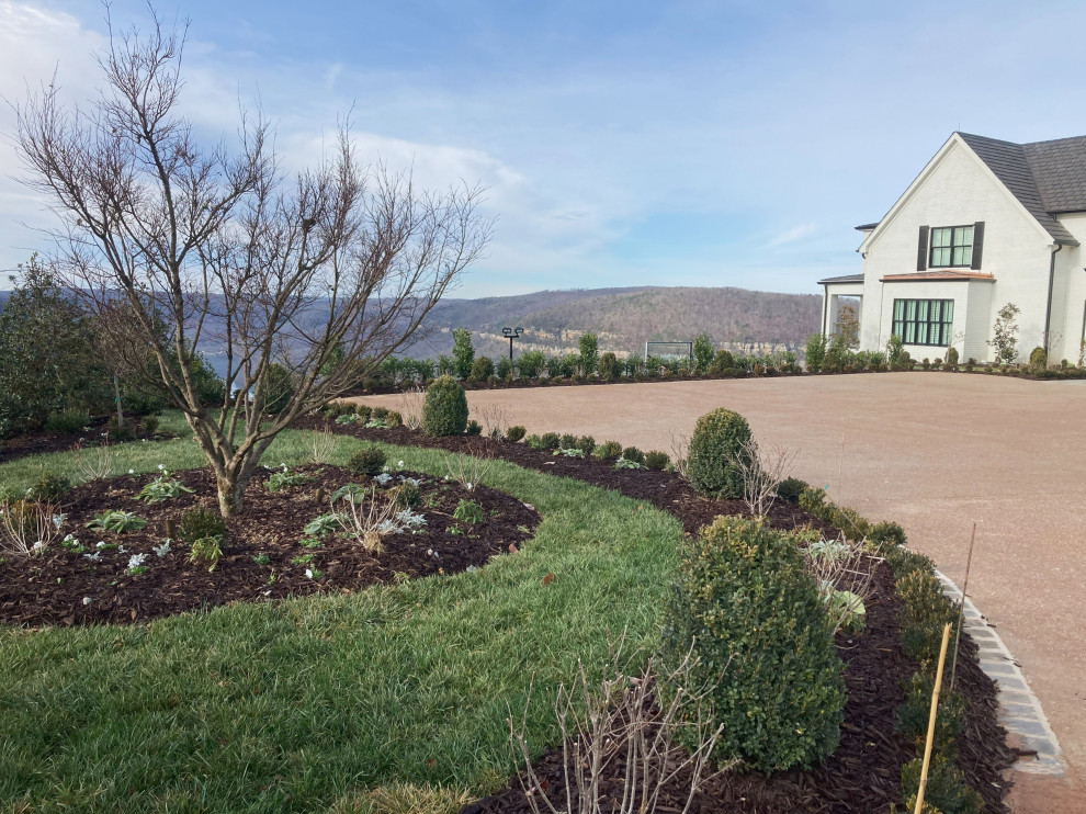 Inspiration for a huge traditional full sun front yard flower bed in Other for winter.