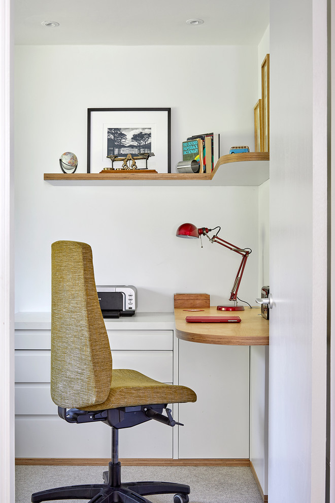Small midcentury home office in Surrey with white walls, carpet and grey floor.