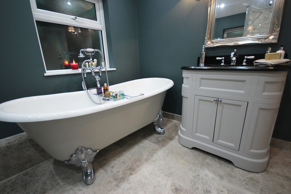 Mid-sized traditional master bathroom in Surrey with a claw-foot tub, an open shower, a two-piece toilet, beige tile, blue walls, an undermount sink, granite benchtops, beige floor and a hinged shower door.