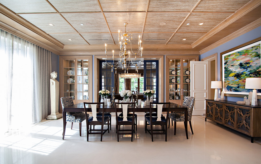 Photo of an expansive transitional dining room in Miami with blue walls and porcelain floors.