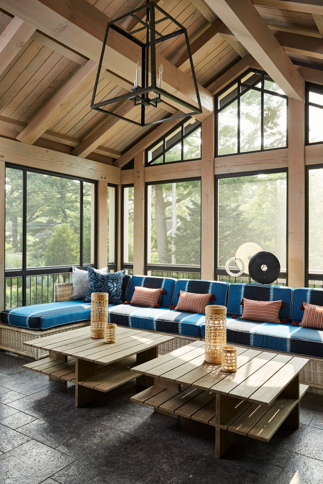 Design ideas for a mid-sized transitional sunroom in Minneapolis with no fireplace, a standard ceiling and black floor.