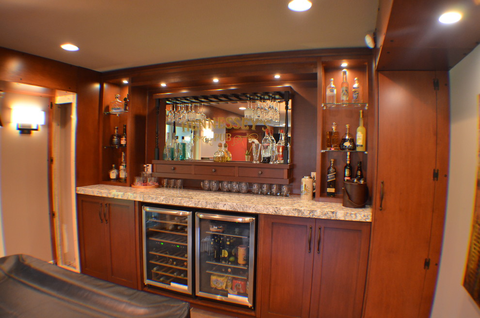 Inspiration for a mid-sized traditional single-wall home bar in Vancouver with shaker cabinets, medium wood cabinets, granite benchtops and ceramic floors.