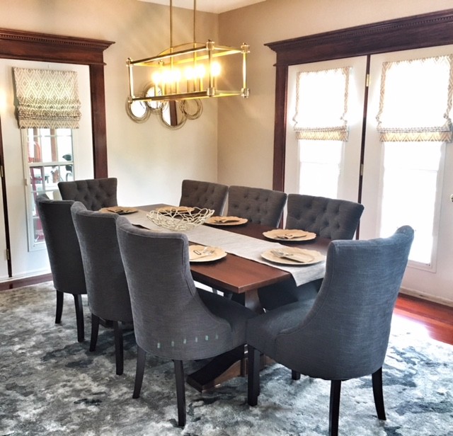 Large transitional separate dining room in Indianapolis with beige walls, medium hardwood floors, no fireplace and red floor.