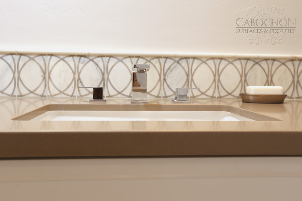 Inspiration for a mid-sized transitional 3/4 white tile and ceramic tile limestone floor drop-in bathtub remodel in San Diego with shaker cabinets, white cabinets, marble countertops, a two-piece toilet, an undermount sink and beige walls