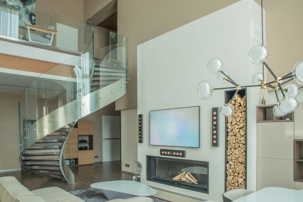 Винтовая лестница Mercury forge со стеклянным ограждением.