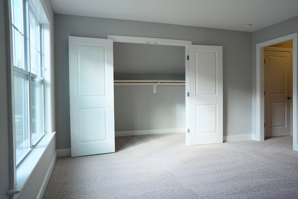Mid-sized contemporary guest bedroom in Raleigh with grey walls, carpet and no fireplace.
