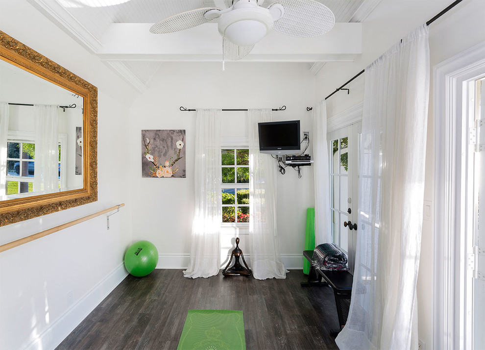 Design ideas for a mid-sized beach style home yoga studio in Other with white walls, dark hardwood floors and grey floor.