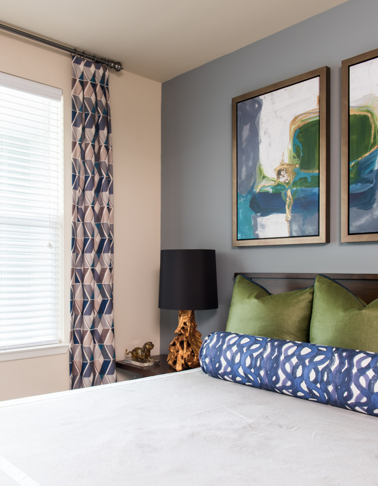 Mid-sized contemporary master bedroom in Other with blue walls, carpet and no fireplace.