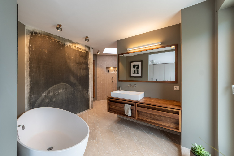Large contemporary master bathroom in Munich with grey walls and beige floor.