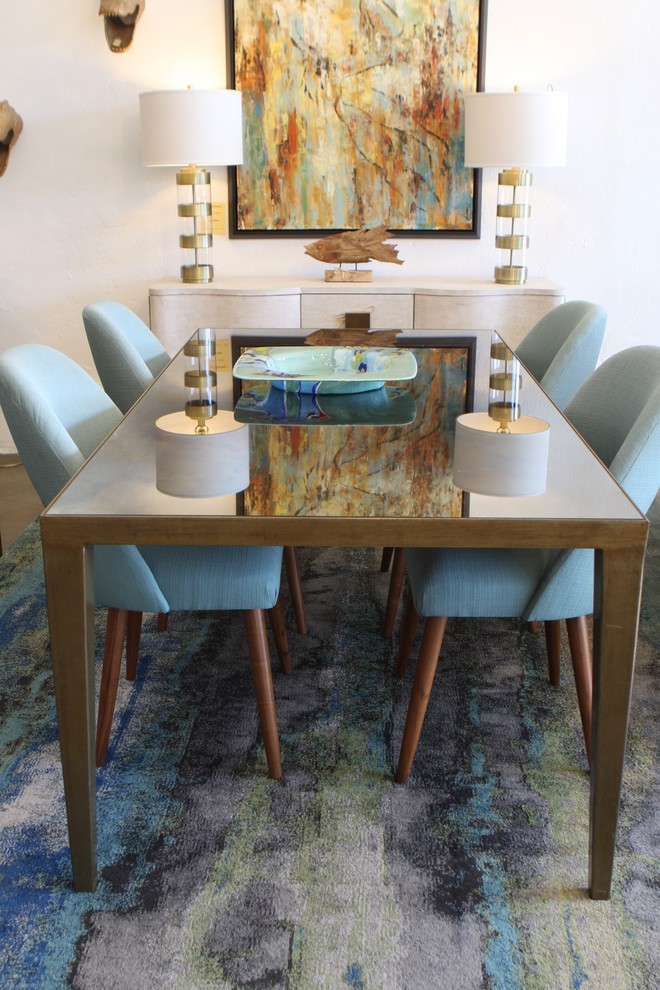 Photo of a mid-sized modern separate dining room in Los Angeles with beige walls, carpet and no fireplace.