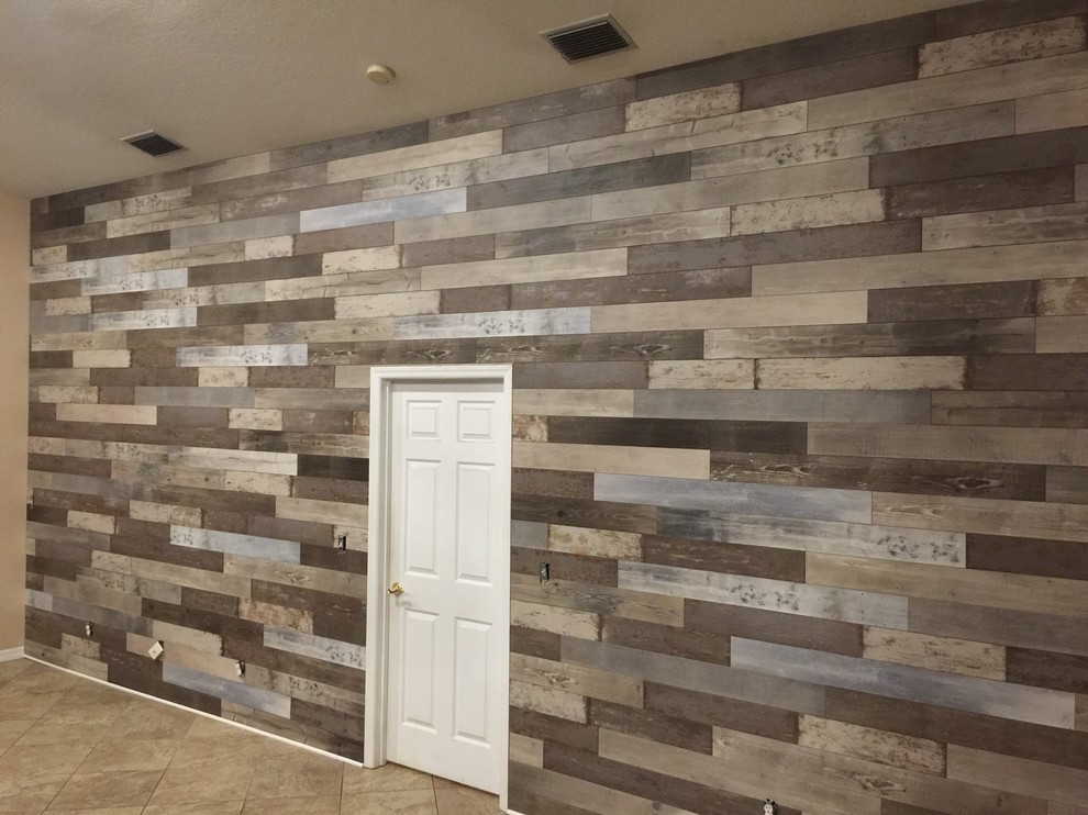 Example of a small transitional travertine floor and beige floor entry hall design with brown walls and a white front door