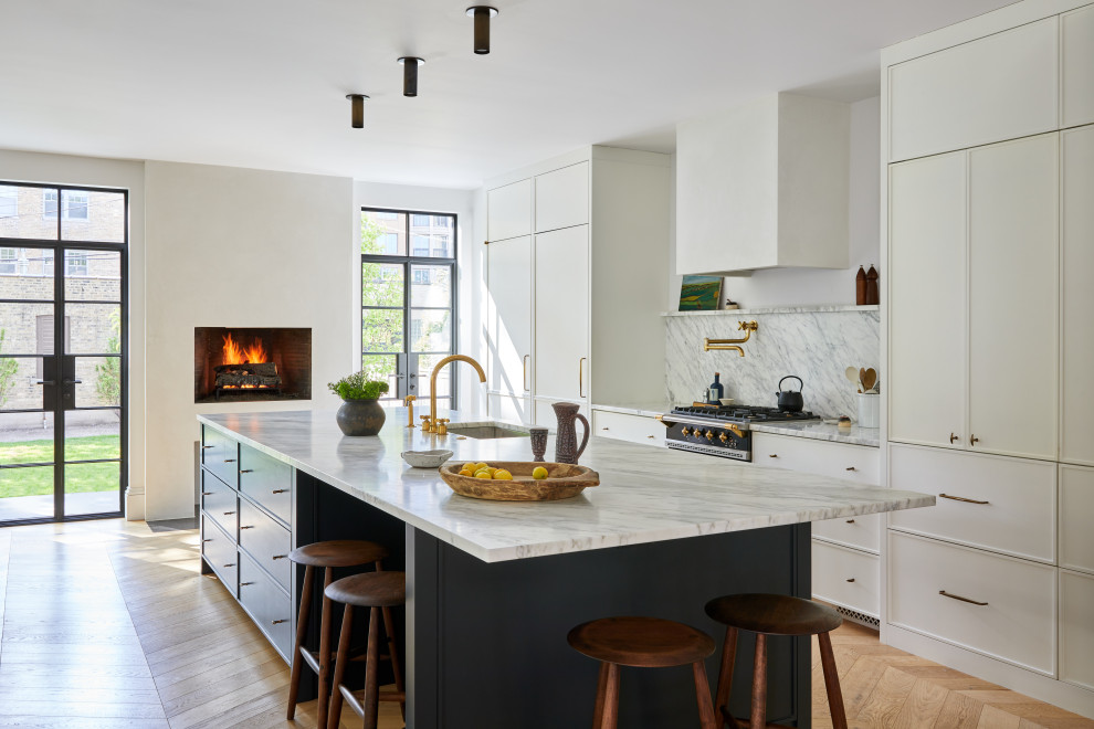 Inspiration for a large transitional single-wall medium tone wood floor and beige floor kitchen remodel in Chicago with an undermount sink, recessed-panel cabinets, white cabinets, multicolored backsplash, black appliances, an island, multicolored countertops, marble countertops and marble backsplash