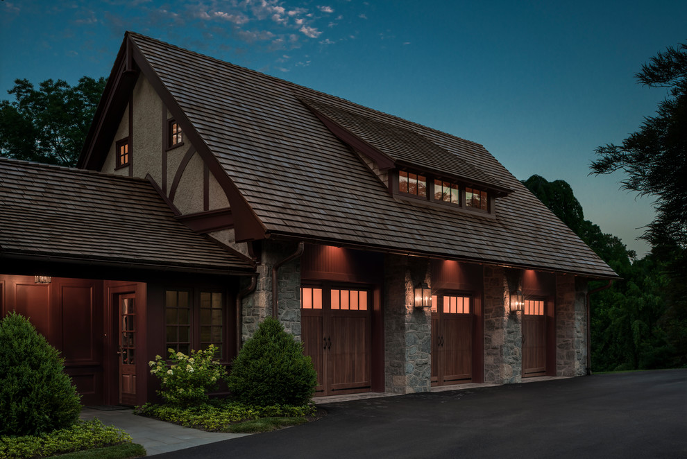 This is an example of a large traditional three-car garage in Philadelphia.