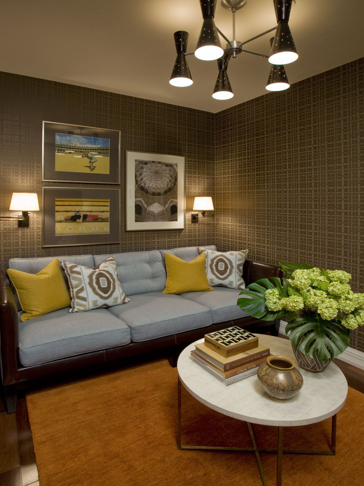 This is an example of an eclectic enclosed family room in New York with brown walls.