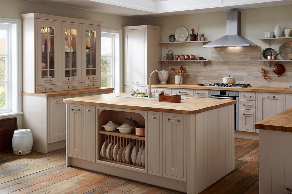 Design ideas for a traditional u-shaped separate kitchen in Other with an integrated sink, shaker cabinets, beige cabinets, wood benchtops, panelled appliances and with island.
