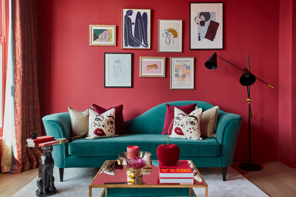 Inspiration for a medium sized bohemian living room in London with a reading nook, pink walls, medium hardwood flooring and a wall mounted tv.