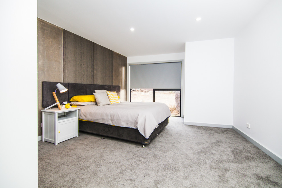 Design ideas for a mid-sized contemporary master bedroom in Hobart with white walls and carpet.