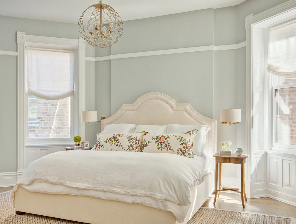 Inspiration for a mid-sized traditional master bedroom in Chicago with grey walls, light hardwood floors and no fireplace.