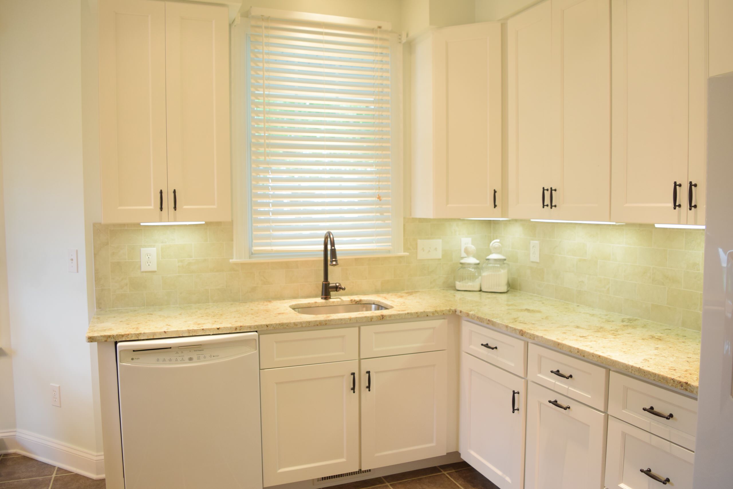 White kitchen with stylish backsplash!