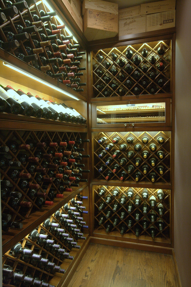 Small traditional wine cellar in Los Angeles with light hardwood floors and diamond bins.