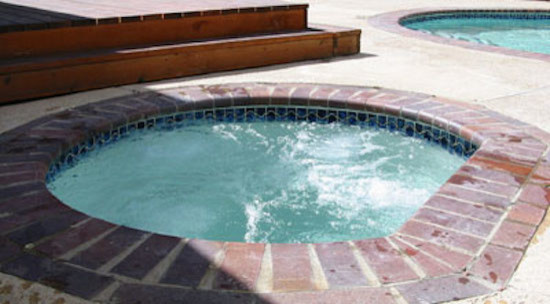 Example of a large backyard natural pool design in Denver