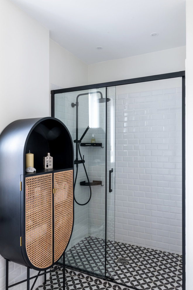 Large contemporary kids bathroom in Paris with light wood cabinets, an alcove tub, an alcove shower, white tile, ceramic tile, white walls, ceramic floors, a drop-in sink, black floor, a sliding shower screen, brown benchtops, a double vanity and a freestanding vanity.
