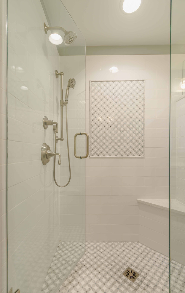 Mid-sized country master bathroom in Chicago with shaker cabinets, white cabinets, an alcove shower, a two-piece toilet, white tile, grey walls, ceramic floors, an undermount sink, solid surface benchtops, grey floor, a hinged shower door, marble, white benchtops, a double vanity, a freestanding vanity, wallpaper and decorative wall panelling.