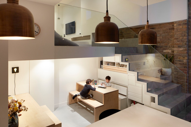 This is an example of a contemporary family and games room in London.