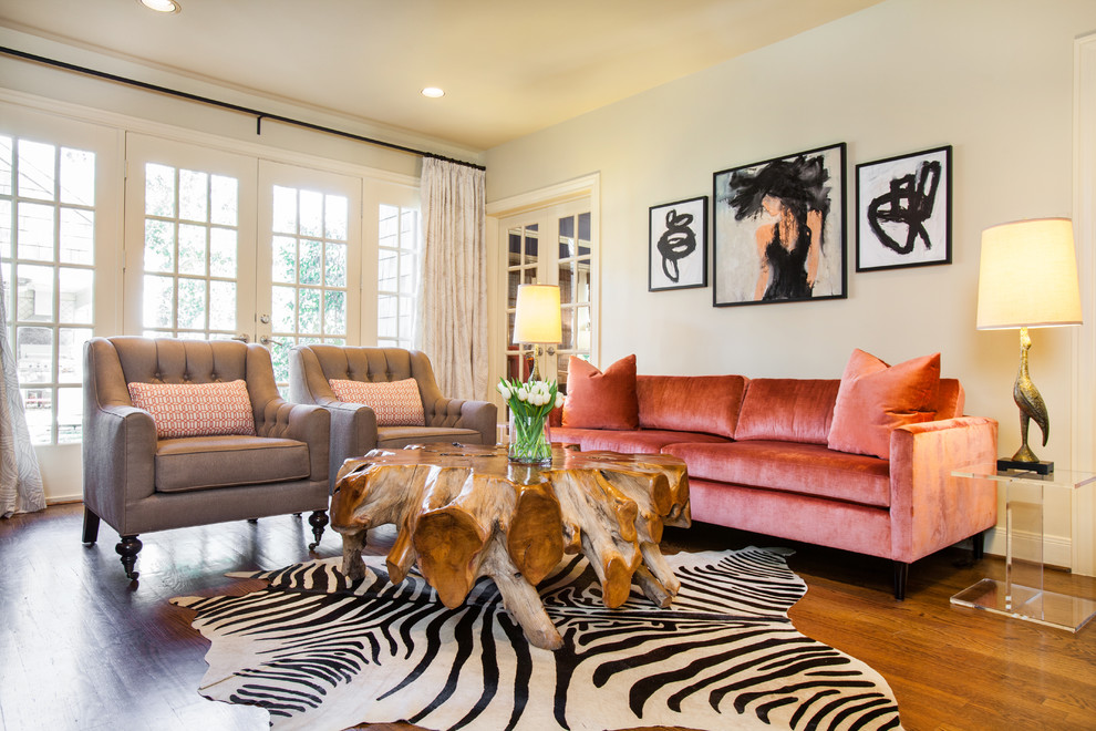 Traditional living room in Houston with medium hardwood floors.