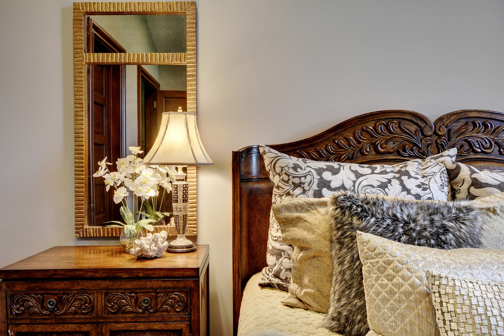 Example of a transitional bedroom design in Austin