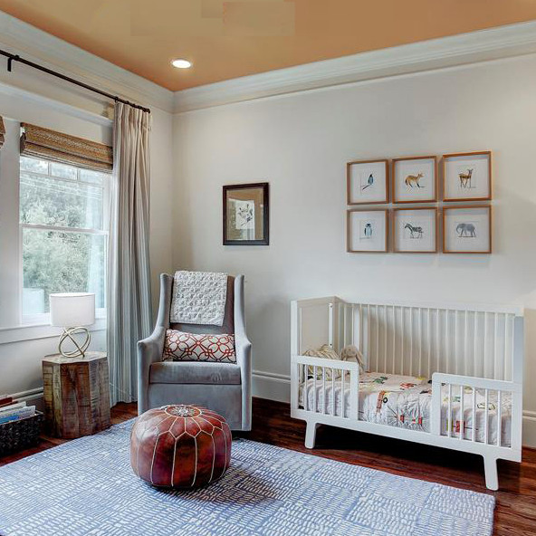 Inspiration for a mid-sized modern kids' room for boys in Houston with white walls, medium hardwood floors and brown floor.