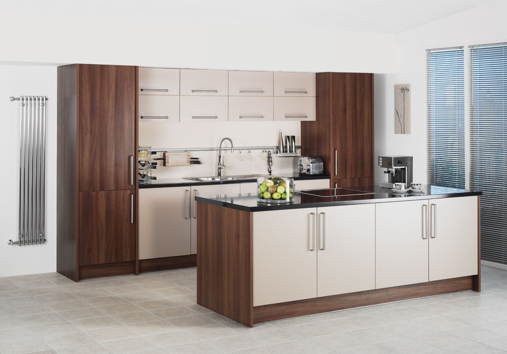 Photo of a contemporary galley kitchen in London with flat-panel cabinets and white cabinets.