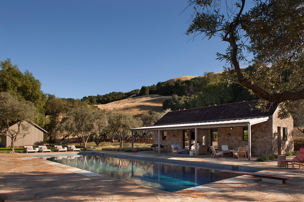 Inspiration for a country backyard rectangular lap pool in San Francisco with a pool house.